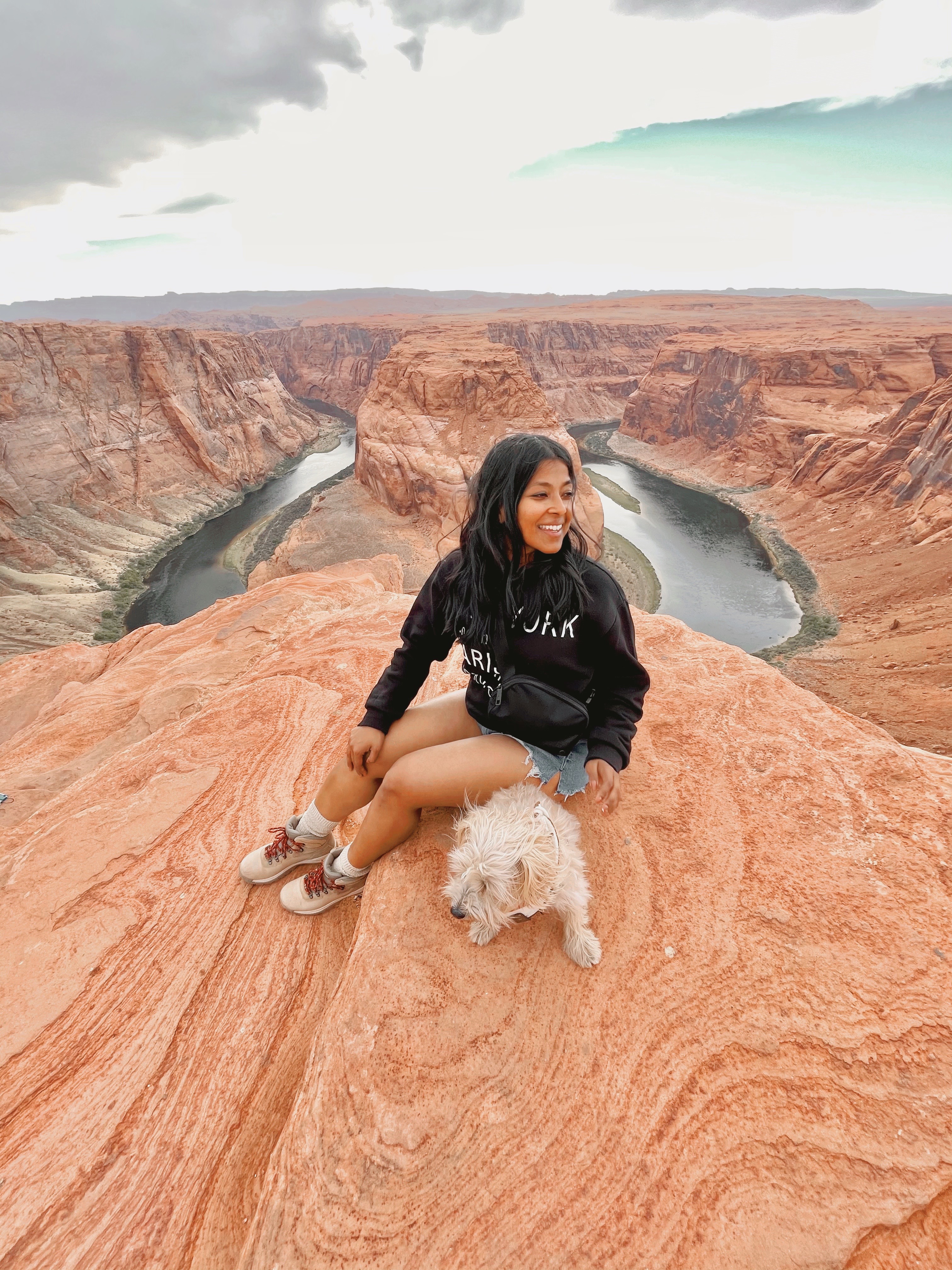 Sharon And Teddy are at Horseshoe Bend In Arizona enjoying the view of the u-shaped rocks.