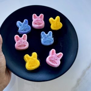 Homemade Easter Dog Treats. Frozen Peeps in blue, yellow and pink are on a plate.