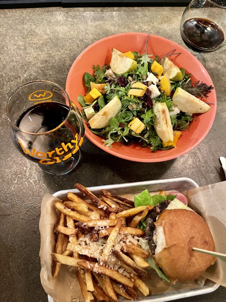 burger, fries, beer and salad at Worthy Kitchen