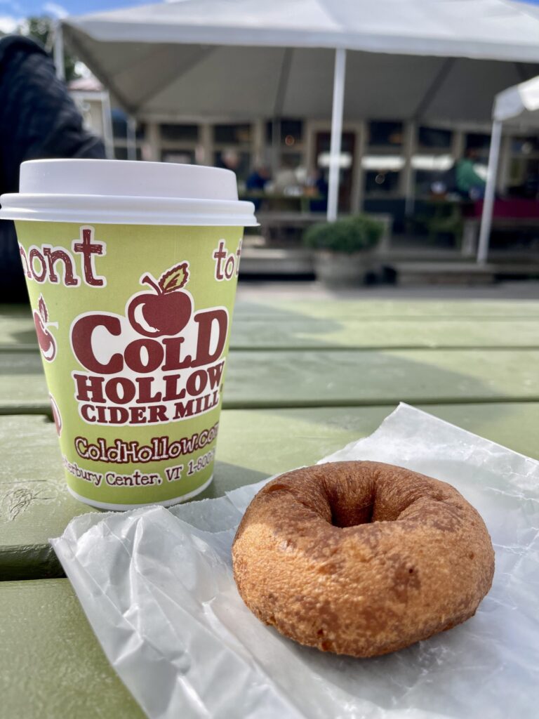 Hot apple cider and hot apple cider donut at Cold Hollow Cider Mill in Stowe Vermont